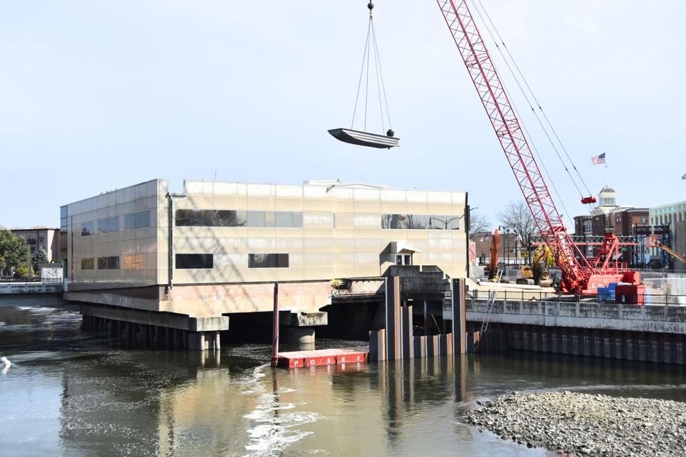 Workers Begin River Work for Demolition